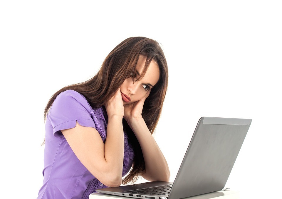 frustrated women head in hands computer laptop