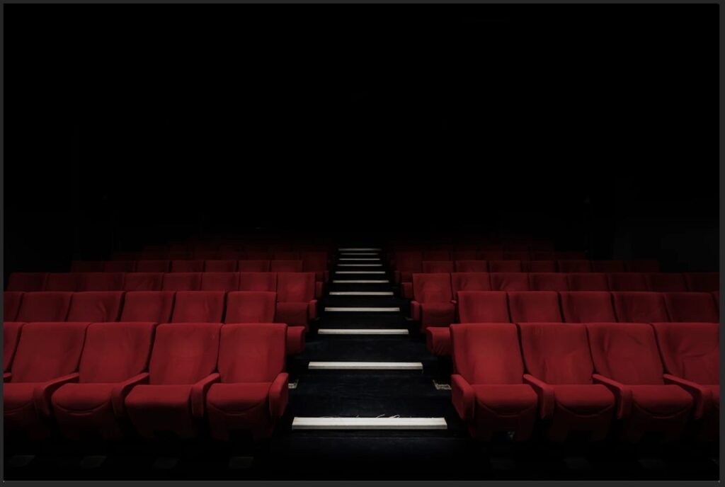 empty theater dark red seats steps