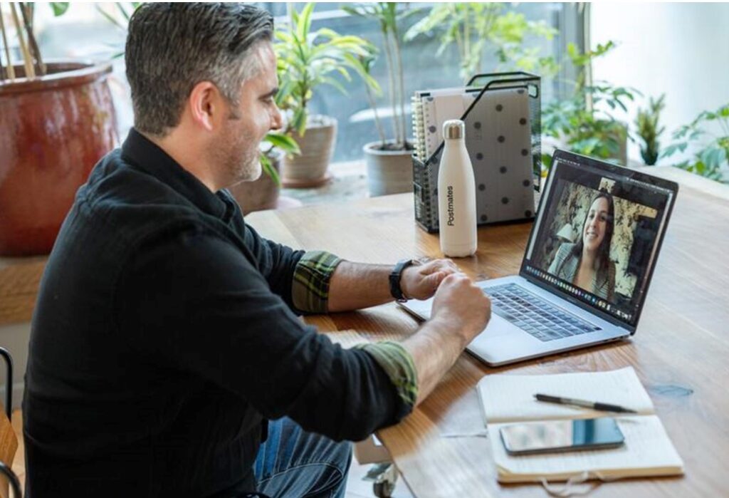 man video conference with women