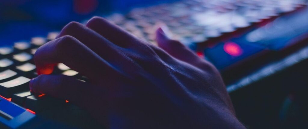 fingers on keyboard blue blurry
