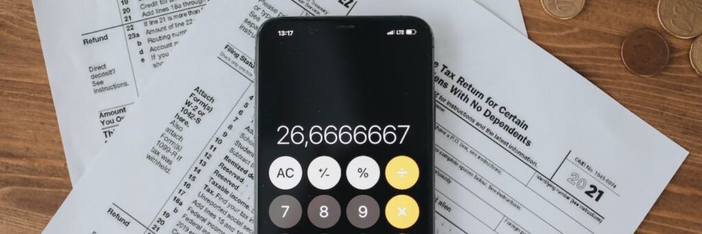 mobile phone calculator on tax documents